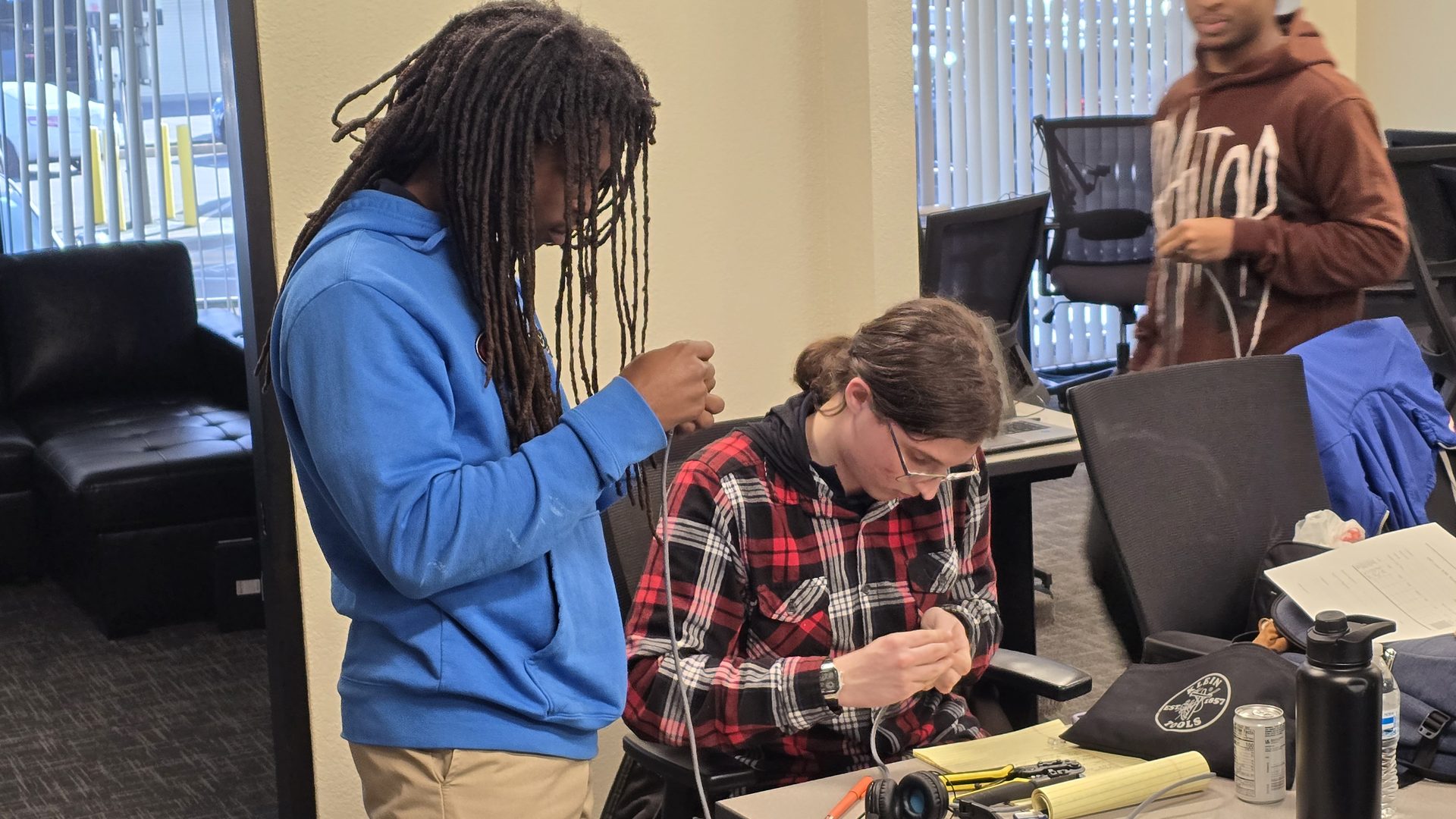 Job Corps students in a hands-on electronics workshop