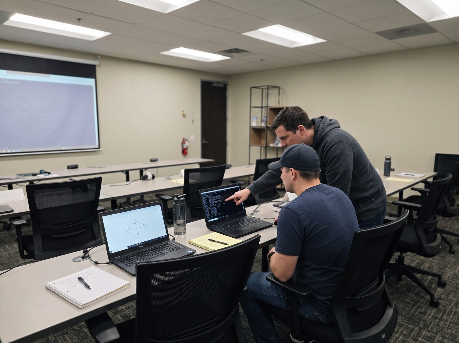 Two students working an ethical hacking lab exercise during CEH training