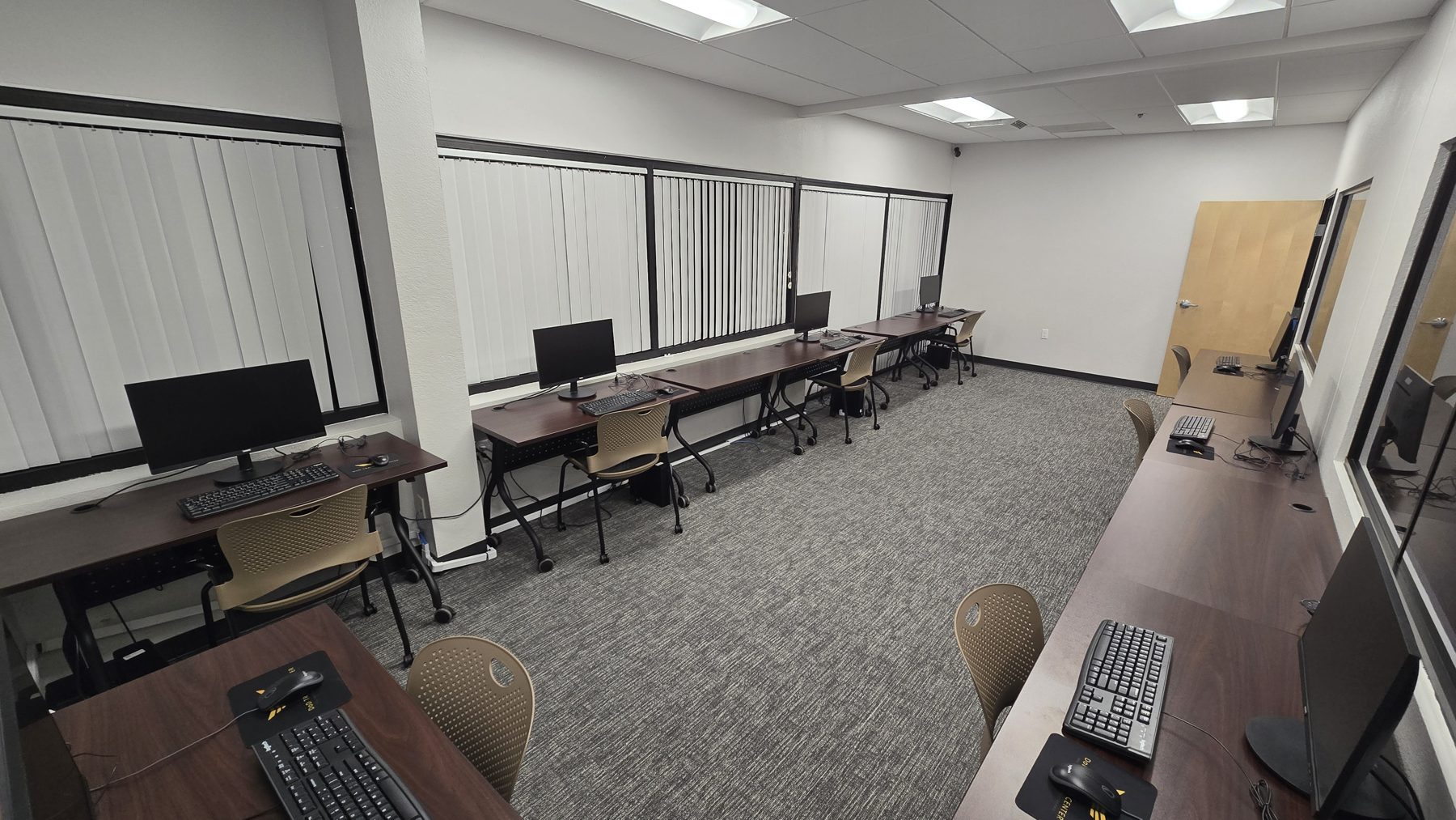 Rows of individual testing workstations inside the Pearson VUE test center